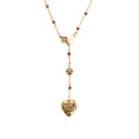 carnelian veil lariat necklace in gold with ornate heart pendant
