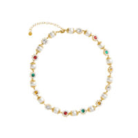 Front view of daisy pearl necklace showing multicolor CZ daisy stations and glossy glass pearls