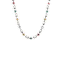 Studio angled view of daisy pearl necklace in silver tone with glass pearls and CZ-set floral charms