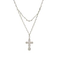 Everette Cross Necklace layered silver‑tone necklace with pearl strand and CZ filigree cross pendant on white background