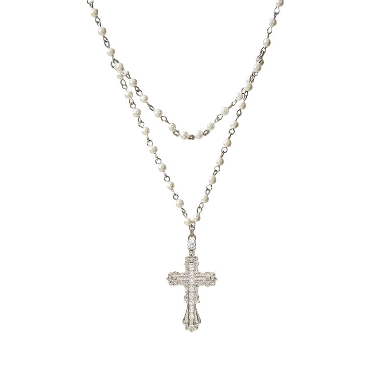 Everette Cross Necklace layered silver‑tone necklace with pearl strand and CZ filigree cross pendant on white background