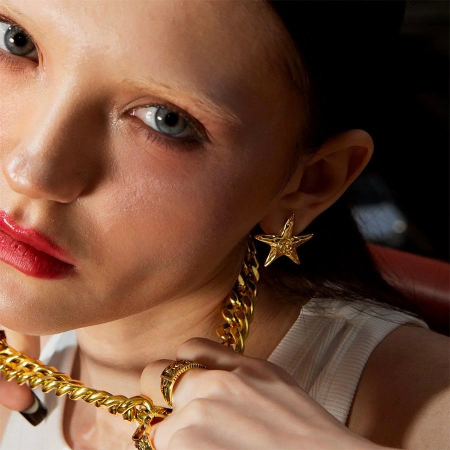 Gold Starfish Stud Earrings worn with statement chain necklace, night-out look
