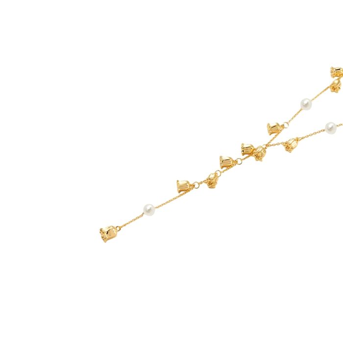 Floral charm and pearl detail on Lily Pearl Lariat Necklace