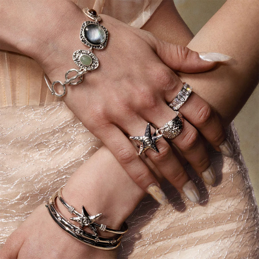 Mermaid-core silver jewelry stack featuring Silver Starfish Ring and starfish charm bangle