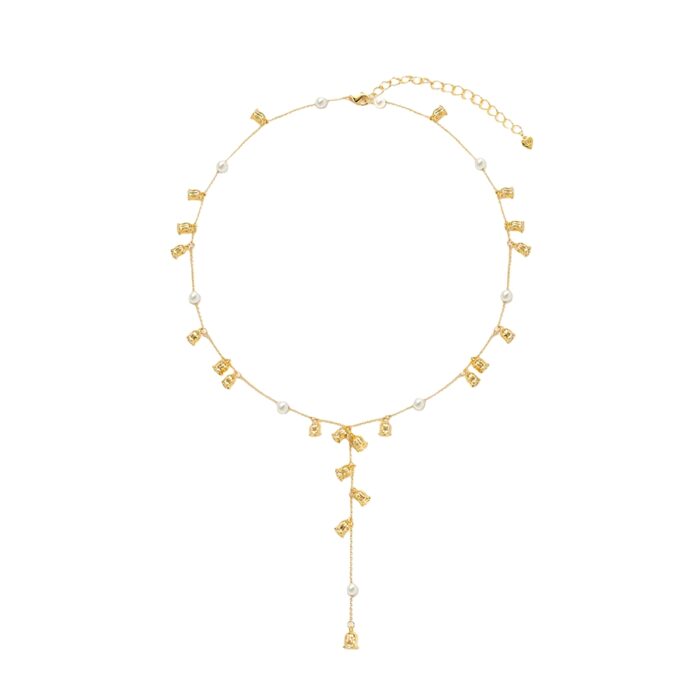 Minimalist pearl Y necklace styled on neckline