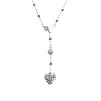 Antique silver lariat necklace with red carnelian beads on white background