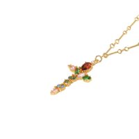 Close-up of Iridescent Cross Necklace cross pendant showing prong-set multicolor CZ stones