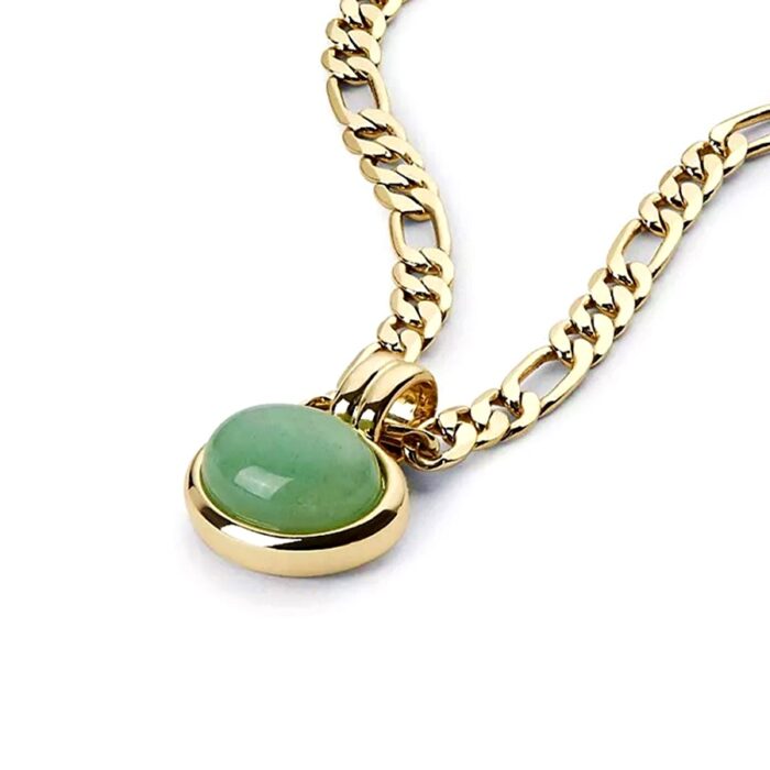 Close-up of oval green cabochon stone pendant in a gold setting