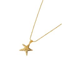Ocean inspired gold starfish pendant necklace with ball chain on white