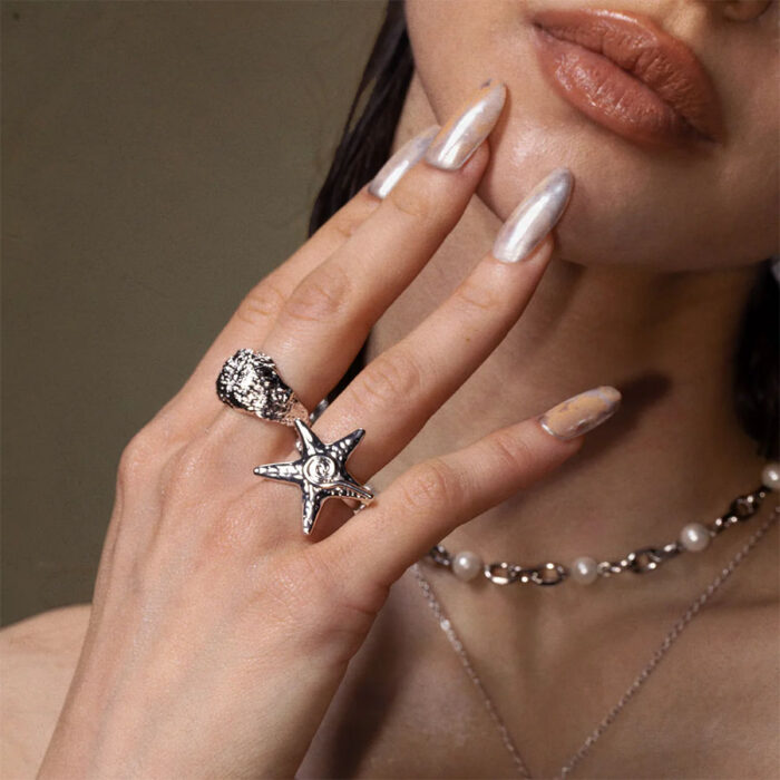 Mermaid-core silver starfish statement ring close-up with textured shell-like detail