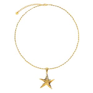 Close-up of gold starfish pendant showing textured ocean-inspired design