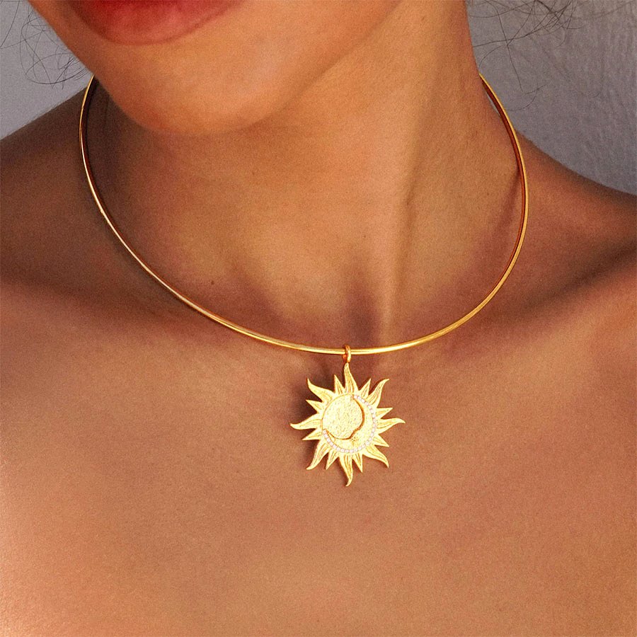 Celestial Astra Choker Golden Necklace worn on the neck with a gold sun pendant in warm, soft lifestyle lighting