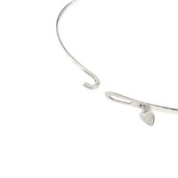 Astra Choker Necklace clasp detail showing a silver hook-and-eye closure and a small heart charm with engraved logo.