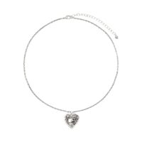 Dainty Silver Belted Heart Necklace with ornate heart pendant, lobster clasp and adjustable extender chain