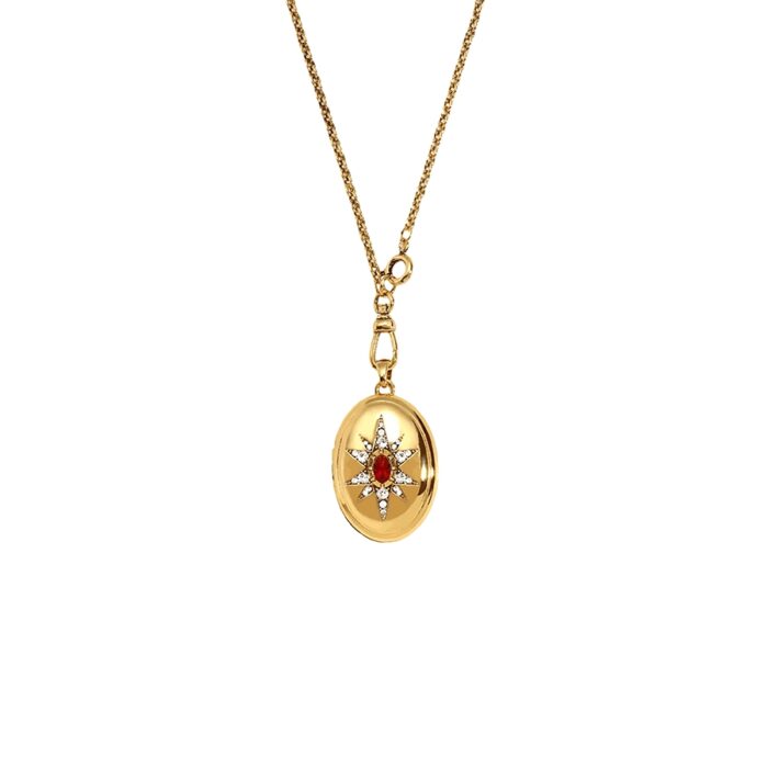 Celestial starburst gold locket pendant necklace with red center stone and clear crystals