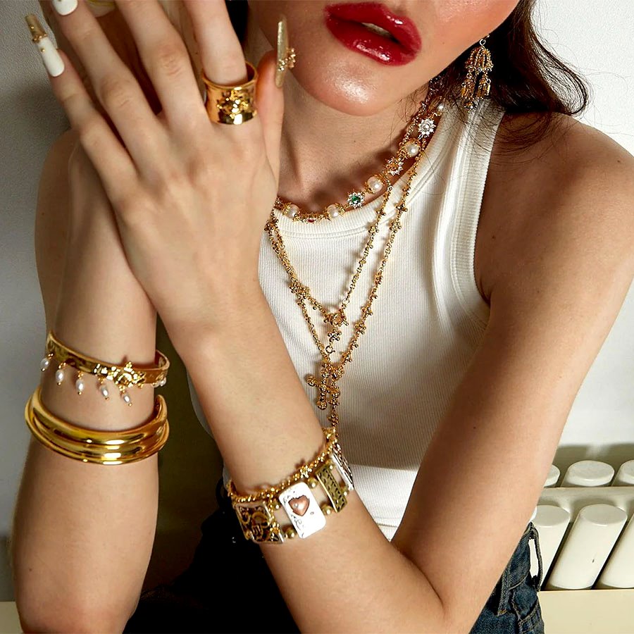 Daisy Molecule Necklace Set street-style layering with cross pearl strand and gold accessories