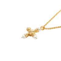 18K gold-tone Florence Cross Golden Necklace with a vintage-style pearl cross pendant against a white background
