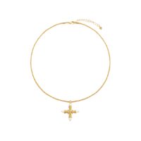 Back clasp detail of Florence Cross Golden Necklace showing lobster claw clasp and adjustable extender chain