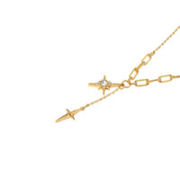 gold star lariat necklace detail—sparkly North Star charm and minimalist four-point star drop on white