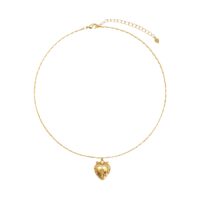 Vintage-inspired heart photo locket necklace with rose floral detail and extender chain, studio white background