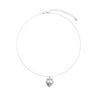 Adjustable silver heart locket necklace for photo memories with extender and heart charm, white background