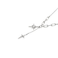 layering star necklace look—minimalist star necklace silver with a second dangling star charm