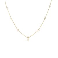 Lucky Clover Golden Necklace gold-tone station chain with CZ clover-floral charms on white background