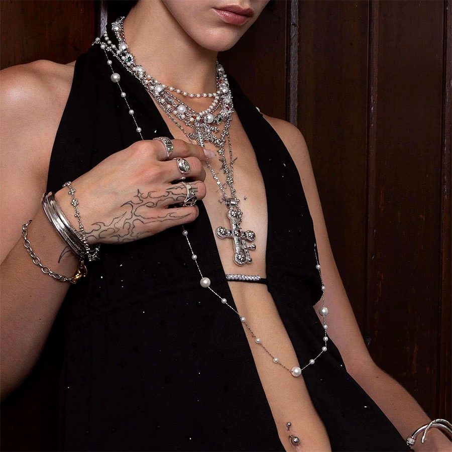 Silver Daisy Necklace Set street-style look with layered pearls, silver jewelry stack, and navel piercing