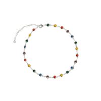 Silver Infinity Choker Necklace rainbow station choker with bezel-set resin stones on white background