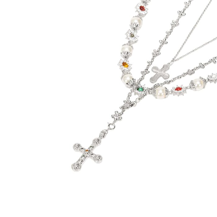silver layered necklace set with mini cross pendant, pearl strand and multicolor gemstone beads, studio product photo