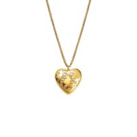 Tender heart locket necklace in 18k gold plated brass with embossed bow and floral details on a wheat chain