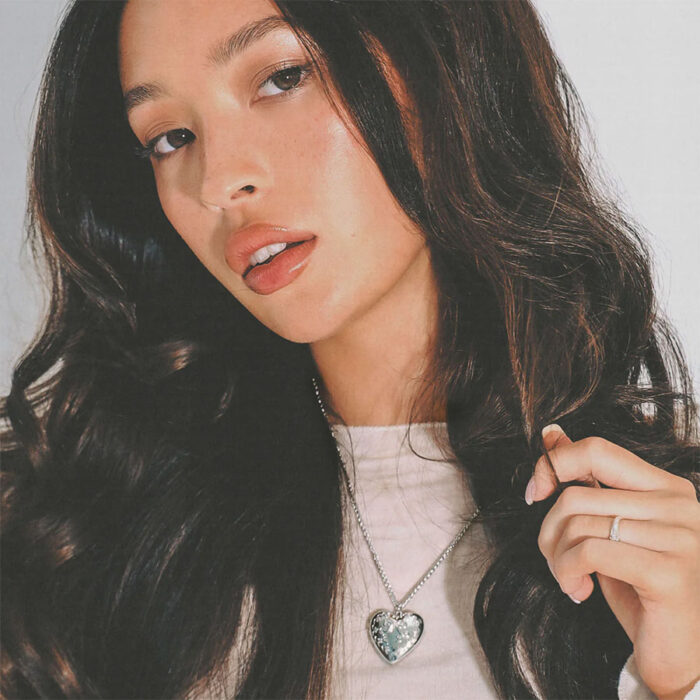 Romantic Lifestyle portrait featuring the Tender openable heart locket necklace vibe in soft studio lighting