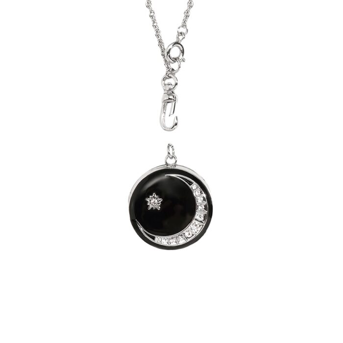 Detachable moon-and-star pendant necklace with black inlay and clear crystal accents on white background