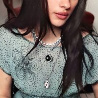 Celestial-core layered jewelry look with silver zeldas star openable locket necklace on model